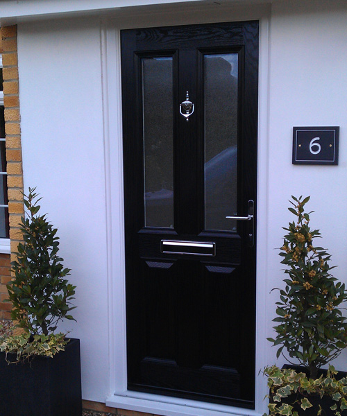 Black Composite door on white house in Oxfordshire fitted by Paradise Windows
