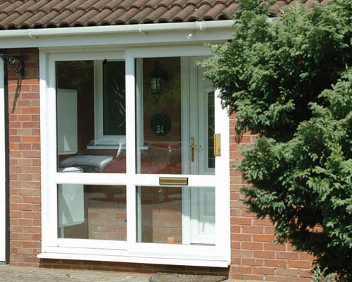 Glass Porch Area with Front Door and uPVC front door both installed by Paradise Windows